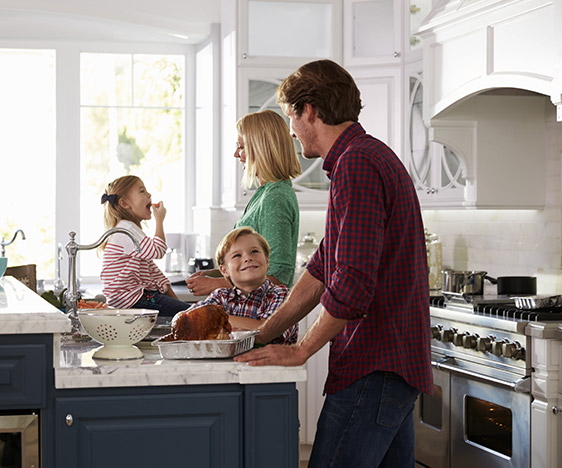 Family having fun in their kitchen