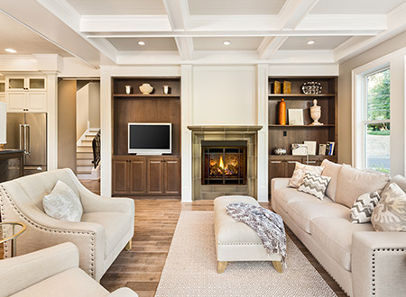 Living room with fireplace and television on a shelf