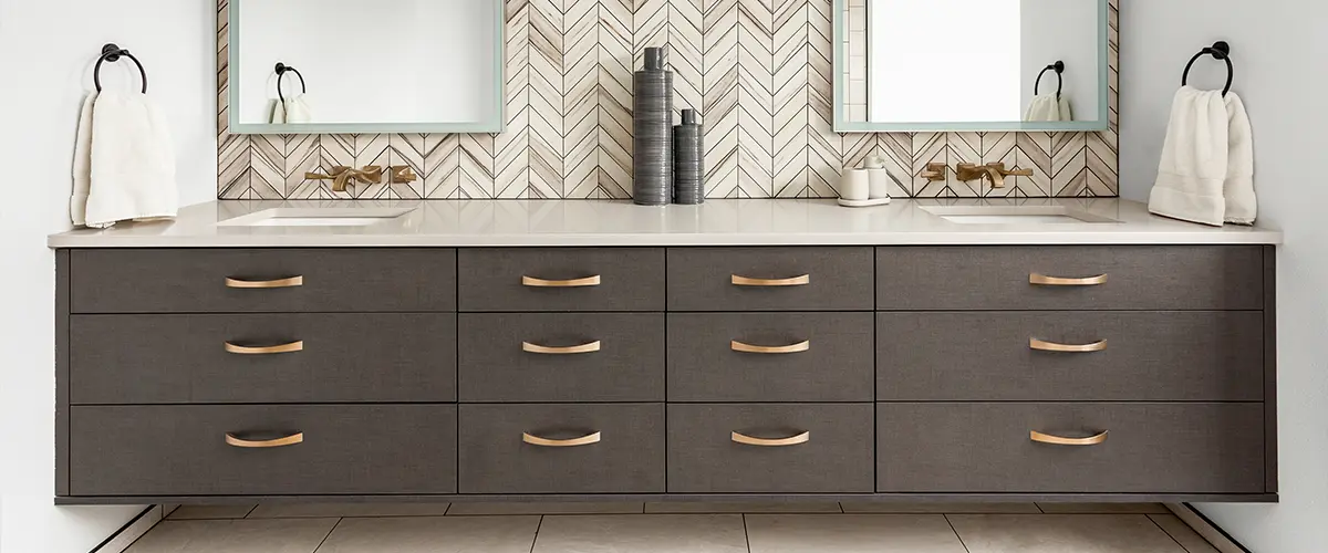 gray vanity with golden hardware