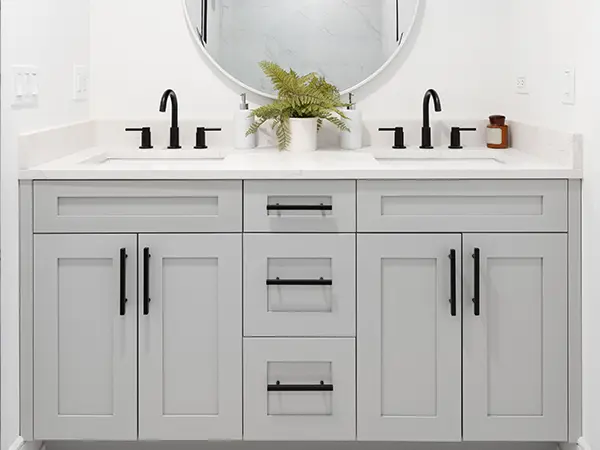 An MDF vanity with black hardware
