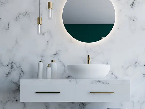 A highly modern and elegant vanity with golden accents and lighting