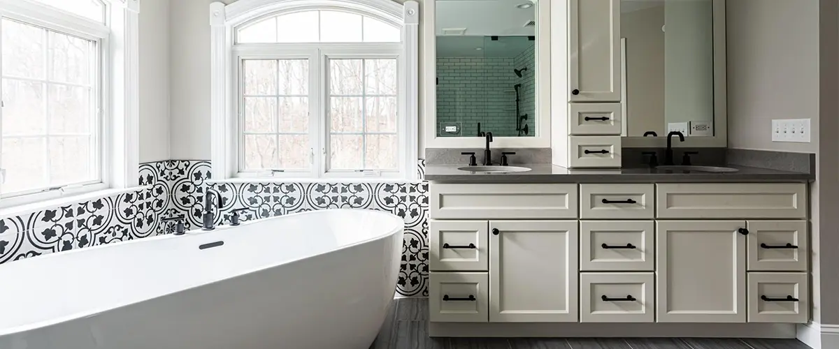 A beautiful white vanity with a freestanding tub