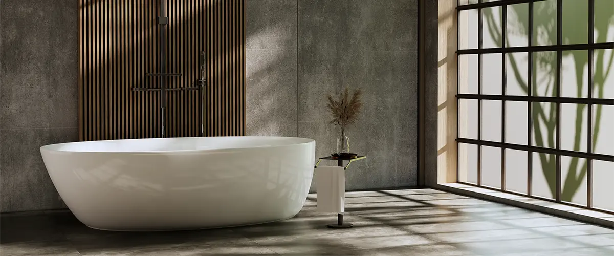 A freestanding tub with a large window