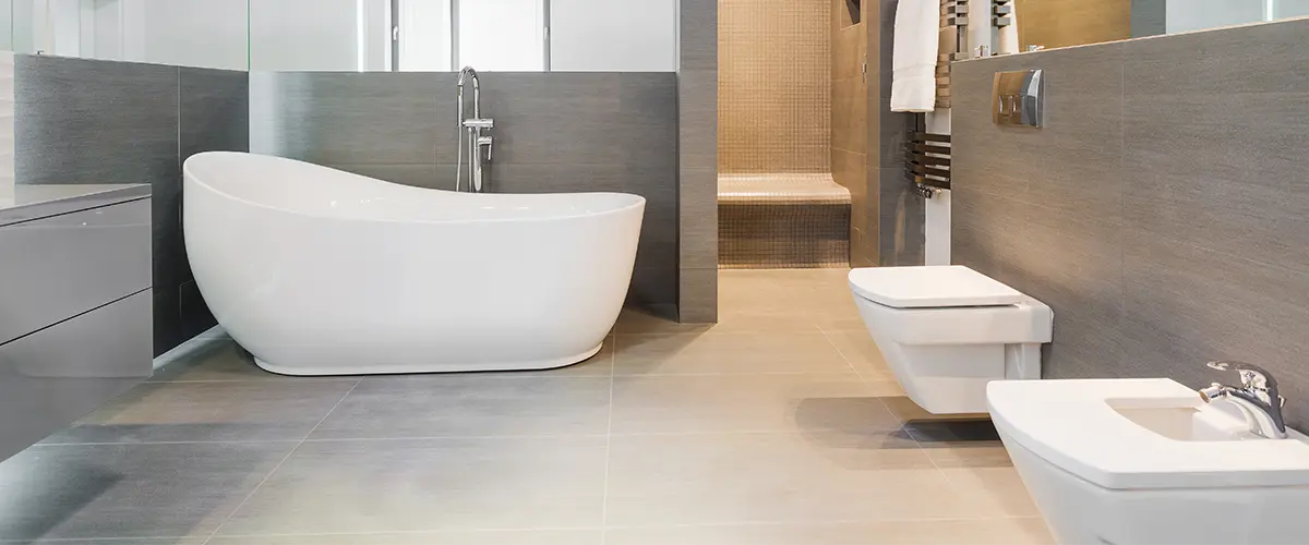 Modern bathroom with freestanding tub and a bidet