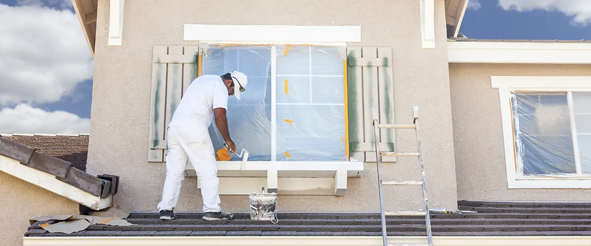 A home exterior remodel with a main painting window frame