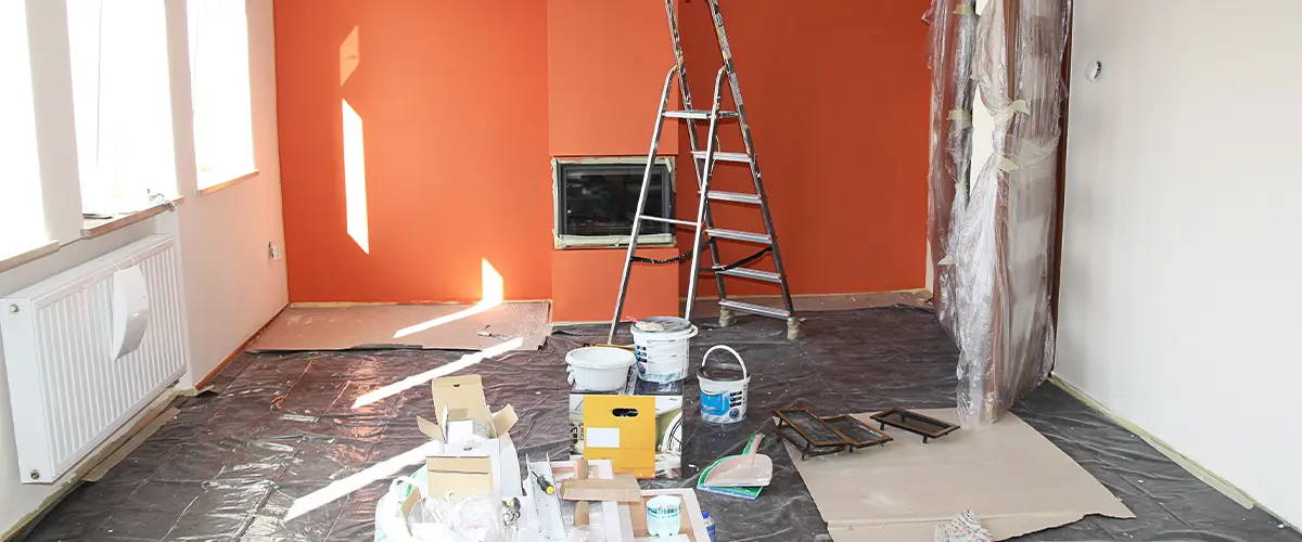 A painting project in a room with orange walls