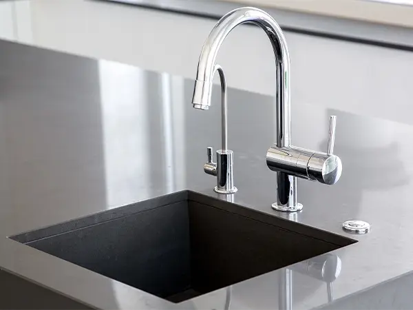 Undermount sink with silver water fixture