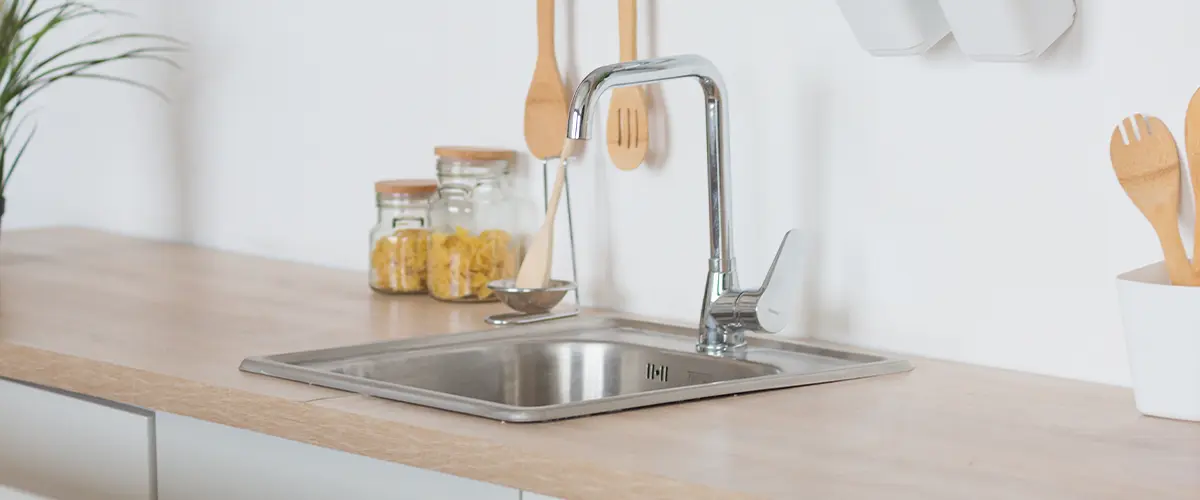 Stainless steel drop in sink on a kitchen countertop