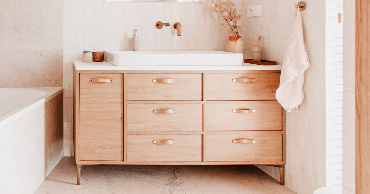 Elegant bathroom with white marble walls and wood vanity