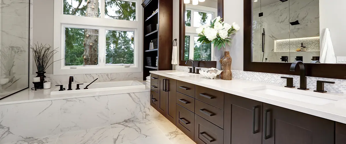 Modern Lynnwood, WA bathroom remodel with elegant marble and nature view.
