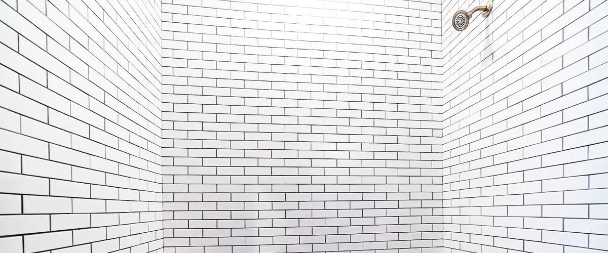 Close-up of shower tiles with grout lines