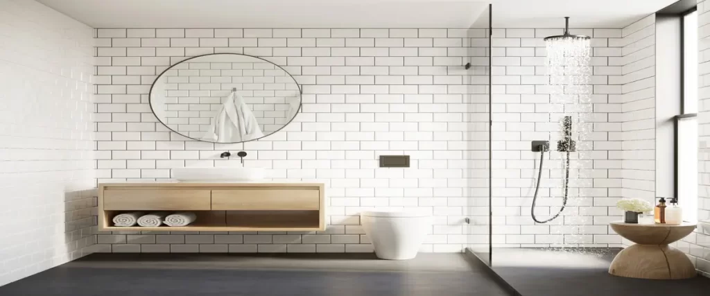 Modern minimalist bathroom with a white subway tile wall, floating wooden vanity, round mirror, and walk-in rain shower