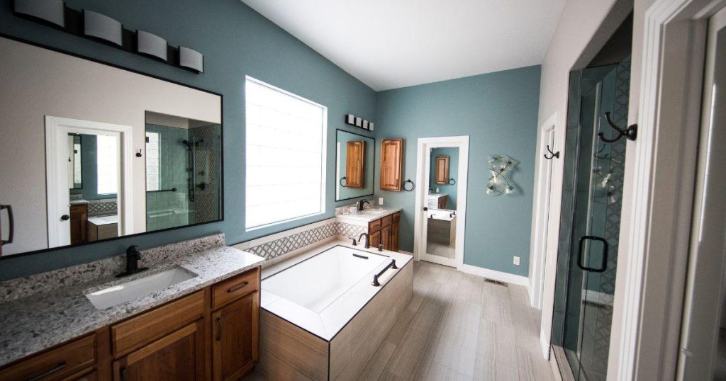 Spacious bathroom with soaking tub and granite countertops