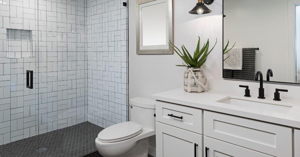 Contemporary bathroom featuring a walk-in shower and white vanity
