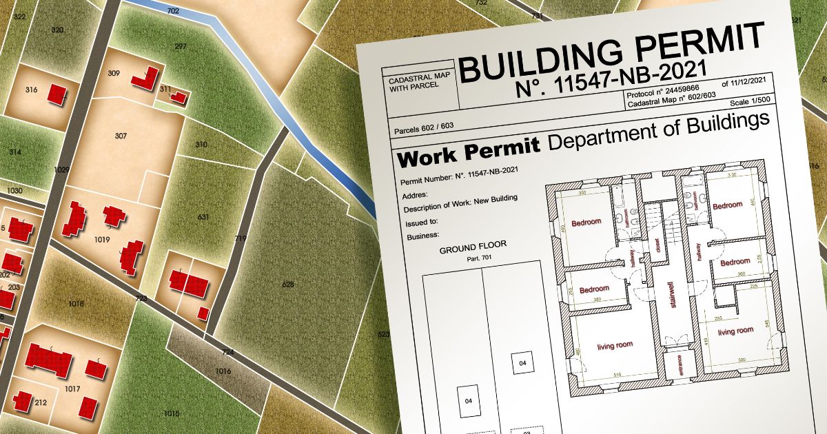 A close-up of a building work permit document placed over a map or planning layout.