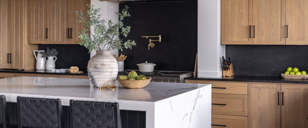 A stylish kitchen with rich wooden cabinets and elegant black countertops