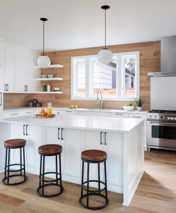 a beautiful minimalist kitchen with wood looking floors and white cabinets