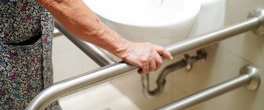 Close-up of a barrier-free shower entry with a low threshold for easy wheelchair and walker access.