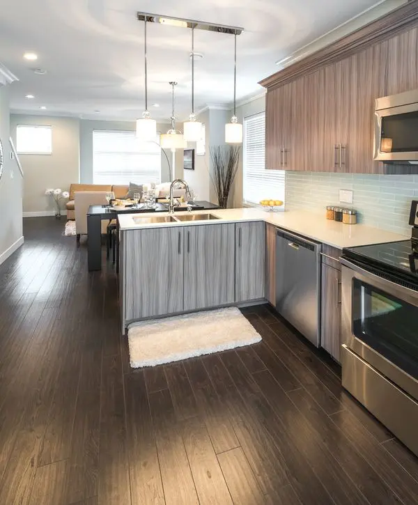 A stunning kitchen remodeling project in Maryvale, AZ with an open island and modern lighting.