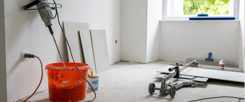 Tile installation tools and materials prepared for bathroom or kitchen remodeling project